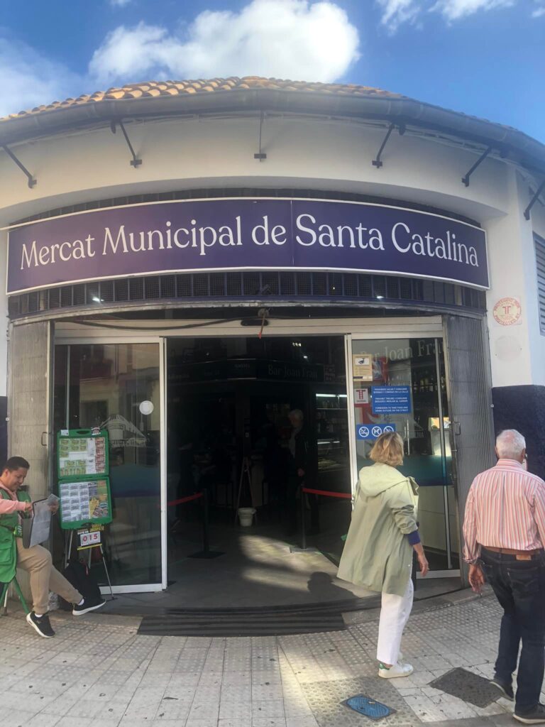 Main entrance of the Mercat Municipal de Santa Catalina, a bustling market in Palma popular for its fresh local products and lively atmosphere.