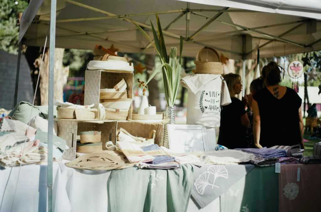 Artisan textiles and handcrafted goods on display at the Alaró weekly market – a celebration of local creativity and culture.