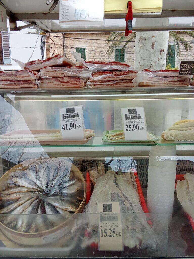 A variety of fresh fish and seafood at the Binissalem market, featuring traditional Mallorcan specialties and high-quality products.
