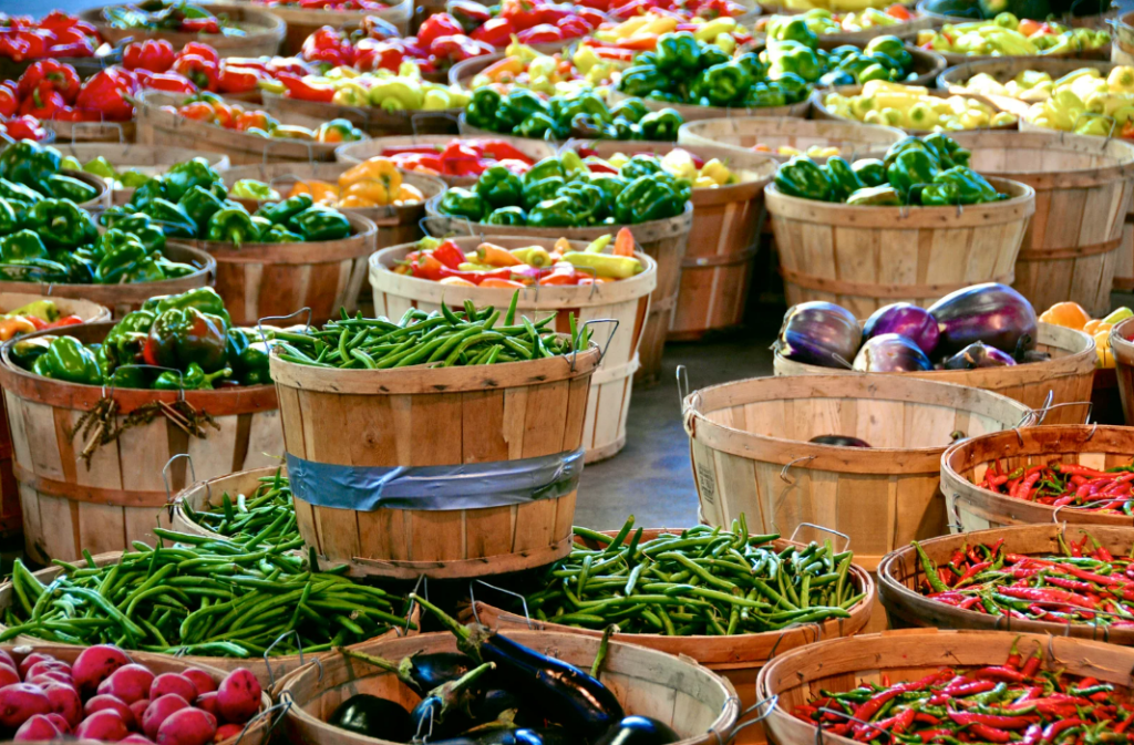 Colorful vegetables at the weekly market in Port de Pollença, Mallorca – a vibrant display of local produce.