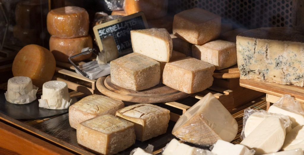 Selection of artisanal Mallorcan cheeses at the weekly market in Son Servera – aged and fresh varieties full of local character.