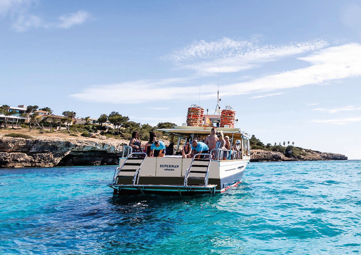 Superman Boat cruising along the stunning coastline of Playa de Palma, Mallorca – the ultimate boat tour experience with spectacular views and sunshine vibes.