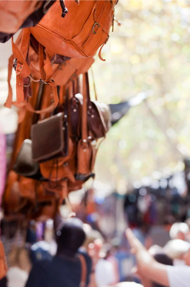Leather bags and backpacks at the market in Inca on Mallorca.